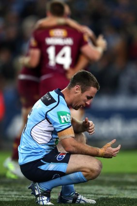 Down and out: James Maloney comes to terms with defeat.