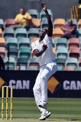 Jason Holder sends down a delivery in the first Test.