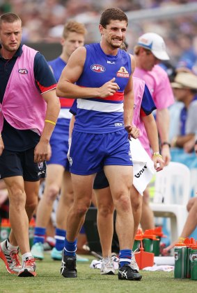 Tom Liberatore hobbles off after injuring his knee on Saturday.