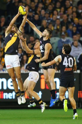 Getting up there: Ben Griffiths marks in the round one match against Carlton.