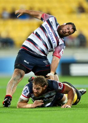 Laurie Weeks reacts as he sustains an injury against the Hurricanes on Friday.