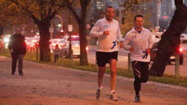 Prime Minister Tony Abbott, seen out jogging in Melbourne on Friday, said the government stopped people-smuggler boats ''by hook or by crook''.
