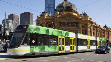 An E-Class tram on Flinders Street. 