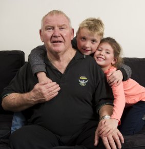 John Nicholson who has early onset dementia with his grandchildren Lincoln, 8, and Zara Nicholson.