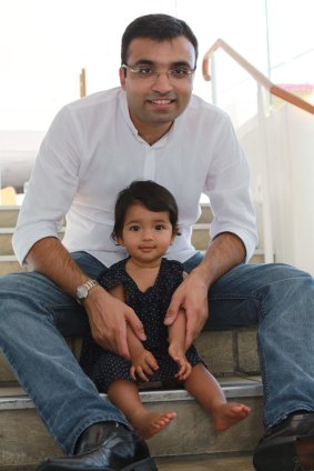 Rasad Merchant, a Melbourne courier saying no to the grey market baby formula, with daughter Aira.