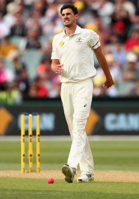 Hobbled: Mitchell Starc limps after a delivery. 