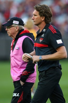 Essendon coach James Hird with the club doctor, Bruce Reid.