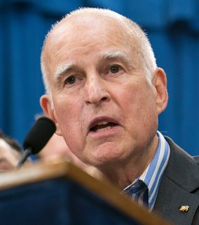 California Governor Jerry Brown speaks in Sacramento, after police chiefs dropped their opposition to the weakened "sanctuary state" bill.