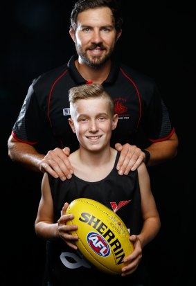 Harrison Parker with his AFL coach, Tyler Smith.