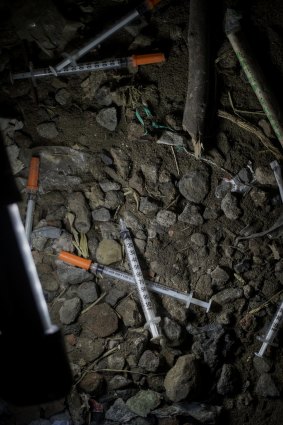 Discarded syringes down a little-used laneway. 