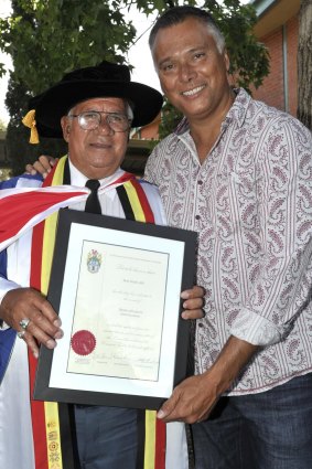With his father, receiving his honorary doctorate from Charles Sturt University in 2013.
