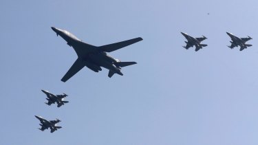 A US B-1 bomber flanked by fighter jets during a show of force over the Korean Peninsula in September 2016.