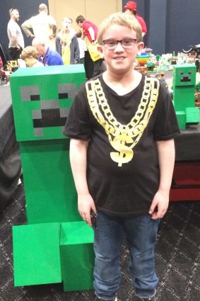 Oscar Williams, 11, of Florey with the massive Minecraft Lego creeper at Brick Expo at the Hellenic Club.