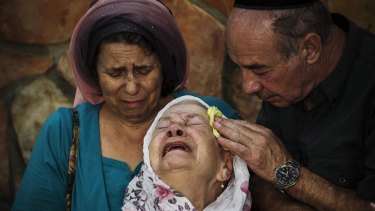 The mother of Albert Alon Govberg mourns at his funeral in Jerusalem. Mr Alon was killed last month in an attack on a Jerusalem bus.