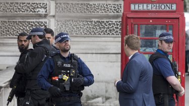 Khalid Mohammed Omar Ali is detained by police officers near Downing Street, London on April 27.