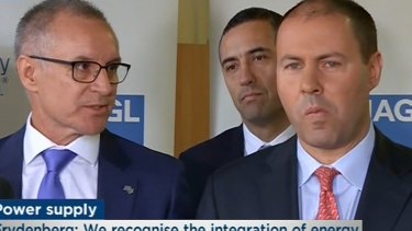 South Australia Premier Jay Weatherill takes a rare glance at Energy Minister Josh Frydenberg during the tense exchange.