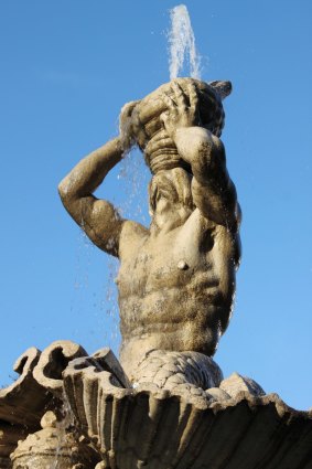 Triton Fountain carved by Gian Lorenzo Bernini in Barberini Square of Rome, Italy.