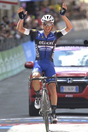 Put your hands up: Italy's Gianluca Brambilla celebrates as he crosses the finish line.