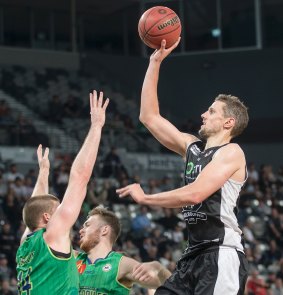 Up and away: Melbourne United's Daniel Kickert, who top-scored with 22 points, takes aim.