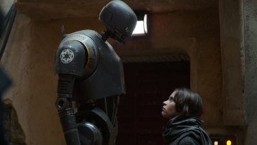 Alan Tudyk as K-2SO (left) and Felicity Jones as Jyn Erso in a scene from <i>Rogue One: A Star Wars Story</i>.