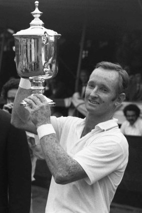 Rod Laver holds the cup high after winning the US Open in 1969.   

