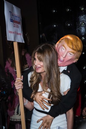 British journalist and heiress Jemima Khan poses for photographers with an effigy of Donald Trump at the Unicef Halloween Ball, in London on Thursday.