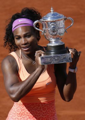 Serena Williams celebrates with the trophy following her victory over Czech Republic's Lucie Safarova at women's final match of the French Open.