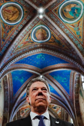 Colombian President Juan Manuel Santos attends a ceremony where he received the St. Francis Lamp peace prize in Assisi's Basilica, Italy, on  December 17, 2016. 