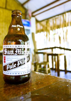 Drinking local: San Miguel beer.