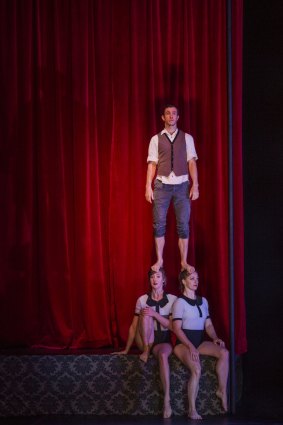 Billie Wilson-Coffey, Kathryn O'Keeffe, and Paul O'Keeffe (standing) perform in Circa's <i>Beyond</i>, at the Canberra Theatre. 
