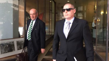 Senior Constable Shaun Moylan (right) allegedly punched a man in a northern beaches police station. 