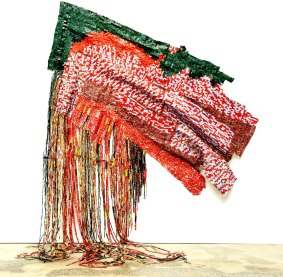 Artist El Anatsui's work made up of bottle tops and discarded items is on exhibition at Carriageworks: pictured is "Awakened".