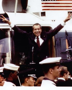 Richard Nixon says goodbye as he boards a helicopter after resigning as president on August 9, 1974.