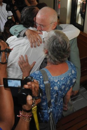 David Taylor embraces his parents John and Janet after the verdict was read out.