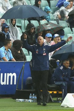 Sydney FC coach Graham Arnold reacts to a decision during the match against Brisbane Roar on Sunday.