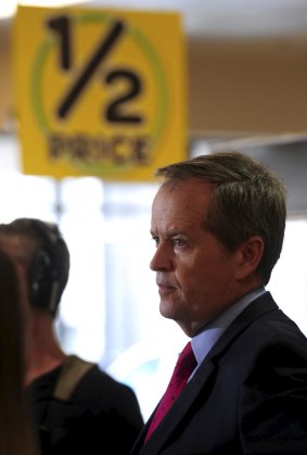 Shorten's media minders tried to keep him away from potentially embarrassing signage but not always successfully.