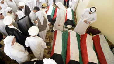 Kuwait flags are draped over bodies of the victims of the mass mosque terror attack.