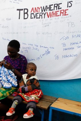 A child contaminated with tuberculosis and her mother wait for treatment. 