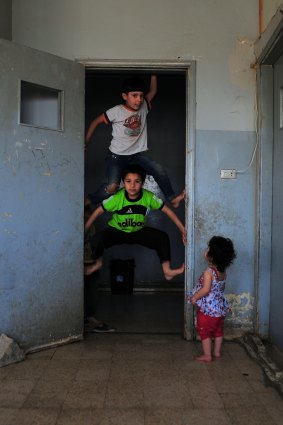 Syrian children play in the school in Baalbek, Lebanon.