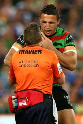 It's gone: Sam Burgess is attended to by a trainer after breaking his cheek in the first tackle of the grand final.