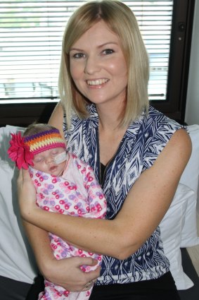 Baby Mia in the arms of mum Kelly Jo.
