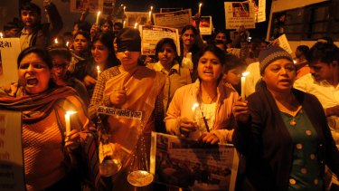 Indians take part in a candlelight vigil for a victim of gang rape in New Delhi, India,  January 13, 2013. .  
