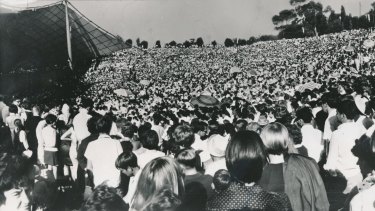 A record-breaking crowd gathers at the Sidney Myer Music Bowl to watch the Seekers perform in 1967.