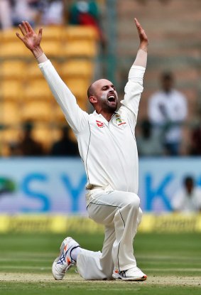 Nathan Lyon appeals successfully for the wicket of India's captain Virt Kohli.