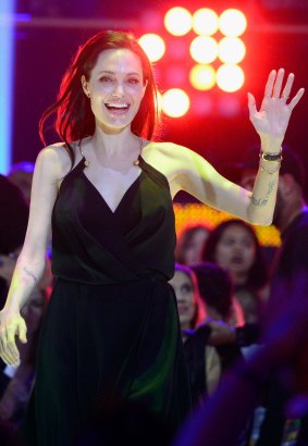 Angelina Jolie walks to stage to accept award for Favourite Villain.