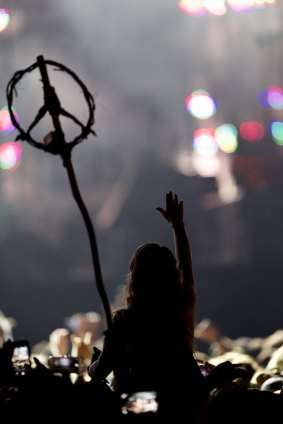 A concert-goer waves a peace symbol during Paul McCartney's show at the Firefly Music Festival in Dover, Delaware on Friday night.