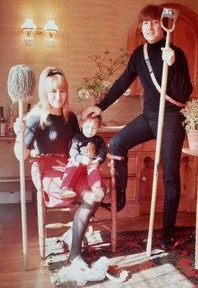 Happier days: John Lennon with his first wife Cynthia and son Julian.