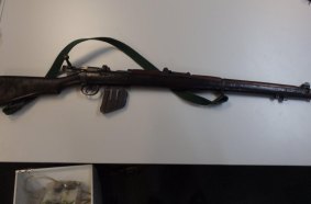 The rifle carried by the gunman.