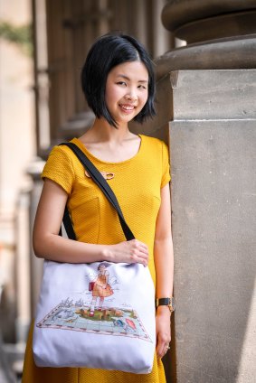 Melbourne lawyer and artist Natasha Sim with a tote bag adorned with her piece that will be sold as part of her first prize in the  ]competition.