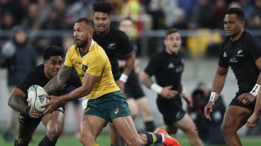 On the loose: Quade Cooper runs the ball against New Zealand in Wellington.